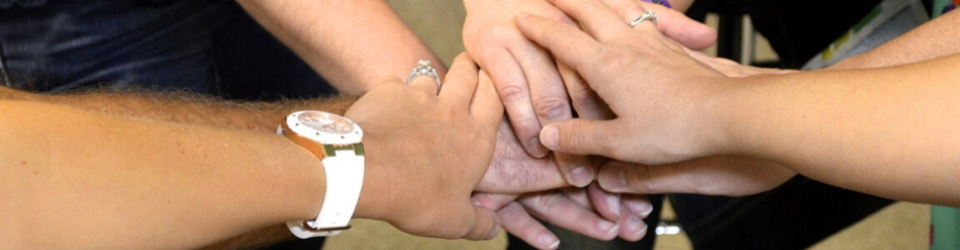 Church members joining hands