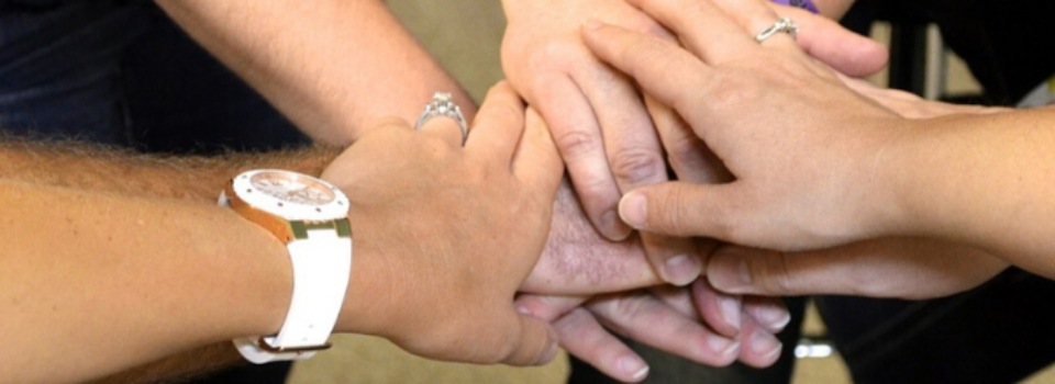 Church members joining hands